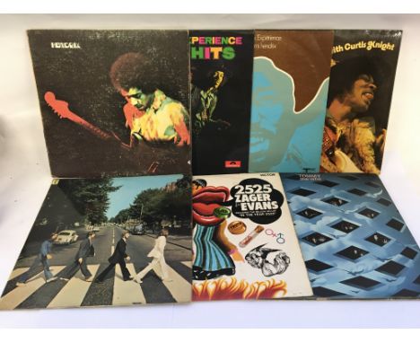 Seven rock LPs by various artists including The Beatles, Jimi Hendrix, The Who and Zager &amp; Evans.