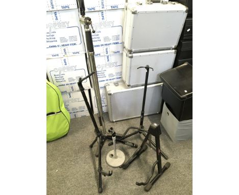 A microphone boom stand, amplifier mic stand and three guitar stands (5).