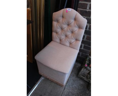 Upholstered button back chair with integral storage 