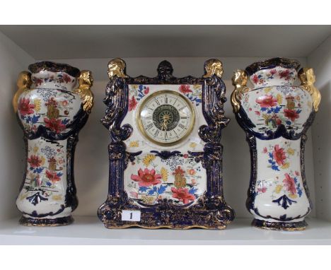Large Phoenix ware Mantel clock with vase garnitures and floral decoration 