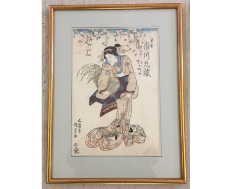by Kunisada (1786-1846) depitcing 'Kabuki Actor Ichikawa Kuzi II playing the role of a courtesan holding a rooster' Circa 182
