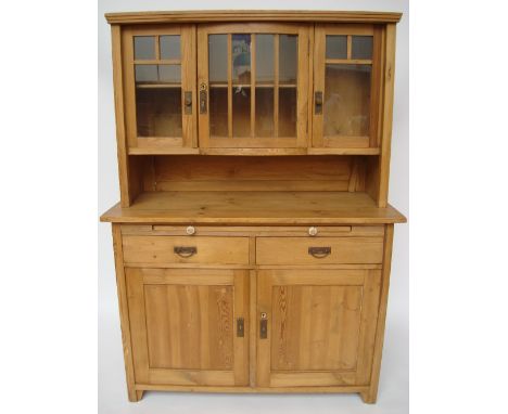 An early 20th Century Continental, poss Secessionist dresser, the upper glazed section with central bowed cupboard door over 