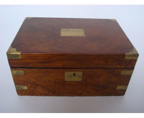 A mid 19th Century brass bound walnut writing slope, the fitted interior with sprung panel concealing two secret drawers. 