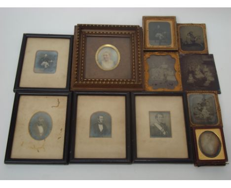 Five late 19th Century tintype photographs, one depicting two small children with a rocking horse, three of family groups wit