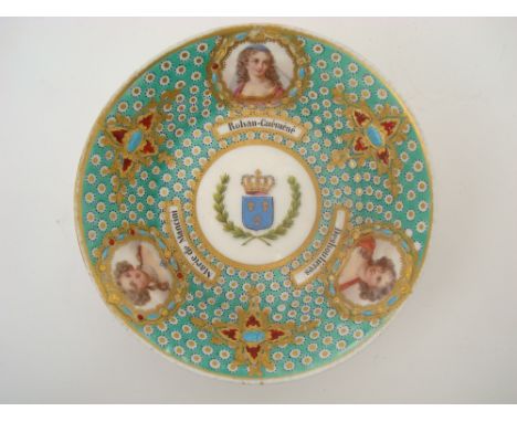 A 19th Century Sevres style 'jewelled' porcelain portrait saucer, the centre painted with the French Royal coat of arms and a