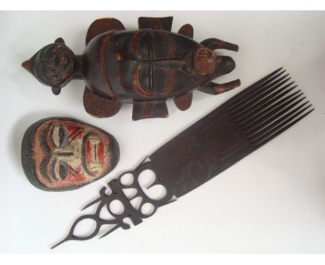 Mid 20th Century West African poss Senufo Kpelie carved hardwood mask with pierced eyes, 45cm high together with another mask