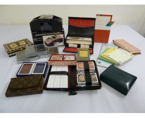 A quantity of playing cards and bridge accoutrements