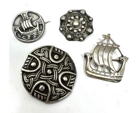 Four Scottish/Celtic silver brooches (31g)