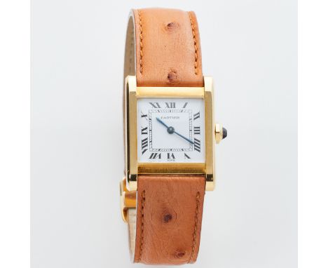 CARTIER - ArmbanduhrFa. Cartier, Schweiz. Modell: Tank Louis Cartier. Um 1985. 750/- Gelbgold, gestemp. Gew.: 35,4 g. Saphir.