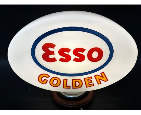 An Esso Golden glass petrol pump globe, stamped Esso Petroleum Limited, chips to base (covered by rubber ring).  