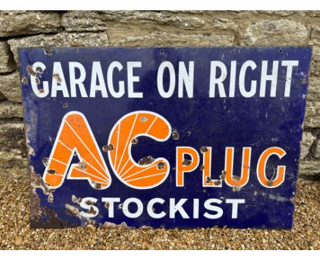 An AC Plug Stockist enamel advertising sign 'Garage on Right', 30 x 20". 