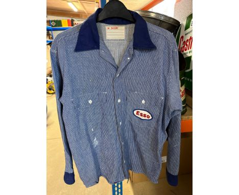 An Esso forecourt attendant's shirt with Esso patches to front and back and pocket to right side. 