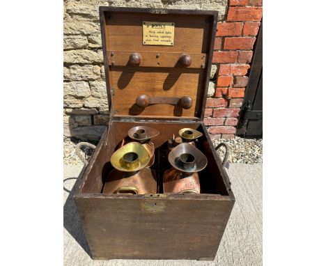 A County Borough of Wallasey (Wirral) wooden trunk containing four Chekpump copper pourers (1/2 gallon, 1 gallon, 2 gallons a