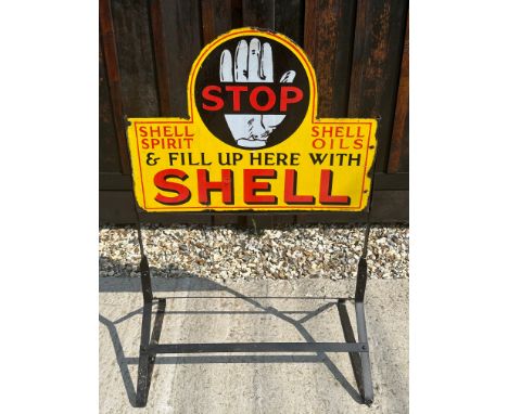 A Shell Spirit and Shell Oils double sided enamel advertising sign set in garage forecourt stand, STOP &amp; Fill Up Here wit