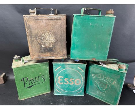 Five two gallon cans: Shell, Shell-Mex, Esso, Pratts and plain, various caps, see image.