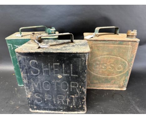 A Shell Motor Spirit two gallon can with Shellmex cap 11'39, an Esso with an Esso cap 5'38 and one other. 