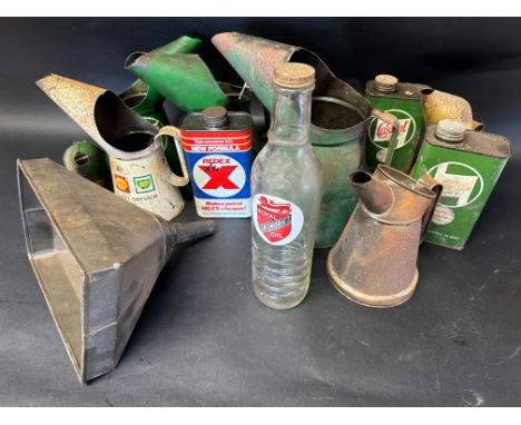 A Royal Snowdrift Oil glass quart oil bottle, a selection of pourers, a large funnel and three motor oil cans, an Esso Blue P