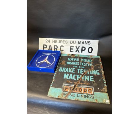 A Ferodo Brake Linings double sided enamel advertising sign, a Mercedes Benz perspex clock and an aluminium 24hrs of Le Mans 
