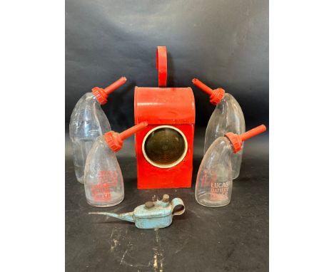 A Sutcliffe oiler, four Lucas glass battery fillers and a Batchlee road lamp. 