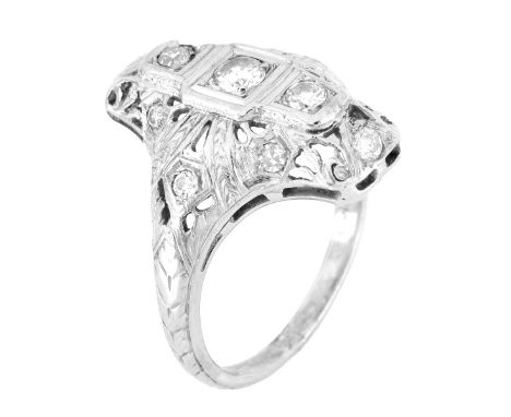 Art Deco Diamond and Filigree 18 Karat White Gold Ring. Stamped 18K. Ring size 7. Approx. weight: 6.1 grams. Condition: Good 