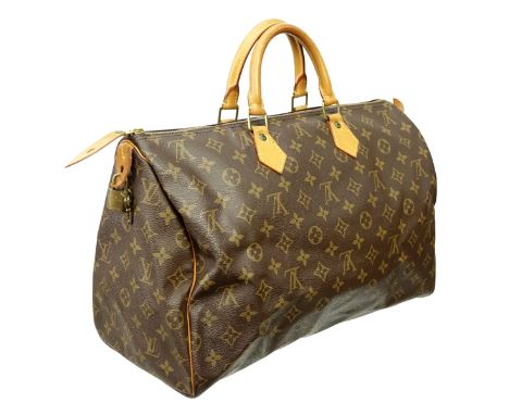 Louis Vuitton Brown Canvas Monogram Speedy 40 Bag. Golden brass hardware, brown interior with slot pocket, vachetta handles. 