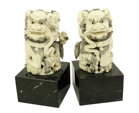 Pair of Chinese Carved Polychrome Ivory Foo Dogs Figures Mounted on Marble Base. Measures 12-3/8" H (overall), figure measure