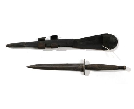 A Copy of a Fairbairn Sykes F.S. Fighting Knife, second pattern, the 17.5cm double edge hand forged steel blade with recessed