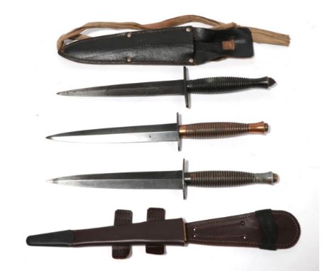 A Third Pattern Commando Knife, the machine forged blued steel blade etched D*/J.Howill &amp; Sons/Sheffield, England, the ri