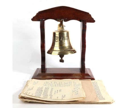 A Brass Bell 'U.B. 44', mounted in a mahogany frame, the bell 16 cm high, together with a small quantity of correspondence re