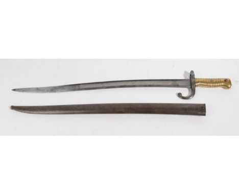 A French Model 1866 Yataghan Sword Bayonet, the St Etienne  T section steel blade engraved and dated 1870, the brass hilt wit