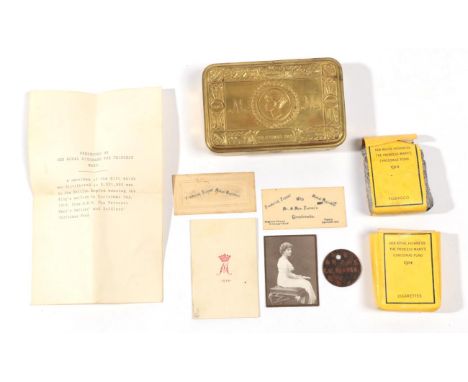 A Princess Mary 1914 Christmas Tin, with contents comprising a packet of cigarettes, a packet of tobacco, a greetings card an