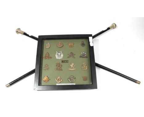 An Ebonised RAF Walking Cane, the silver plated mushroom shape pommel embossed with the RAF badge with QEII crown, the taperi