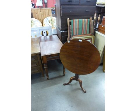 A Victorian mahogany Pembroke table and a George III mahogany circular tilt top tripod table 