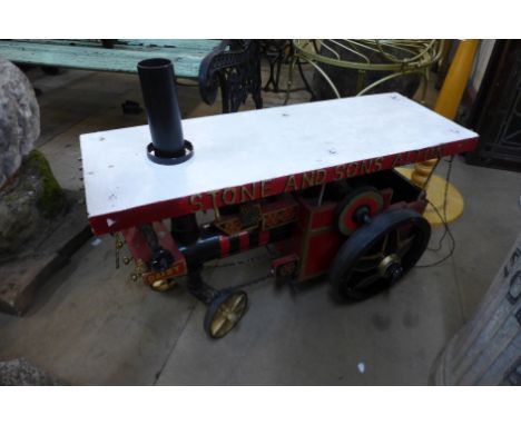 A painted wooden model of a steam engine 