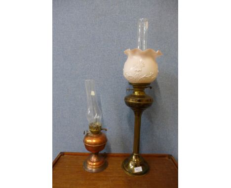 A brass oil lamp and a copper electric lamp 