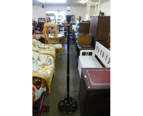 A black Japanned standard lamp 
