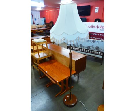 A teak standard lamp 