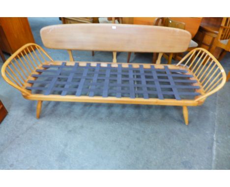 An Ercol Blonde elm and beech 355 model studio couch 