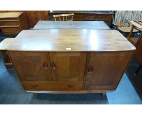 An Ercol Golden Dawn elm and beech Windsor sideboard 