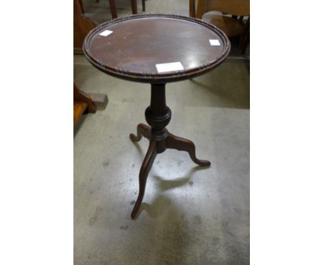 A mahogany tripod wine table 