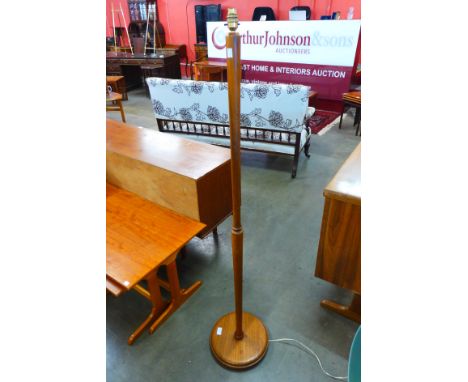 A teak standard lamp 