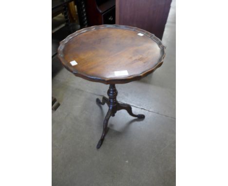 A Reprodux mahogany tripod wine table 