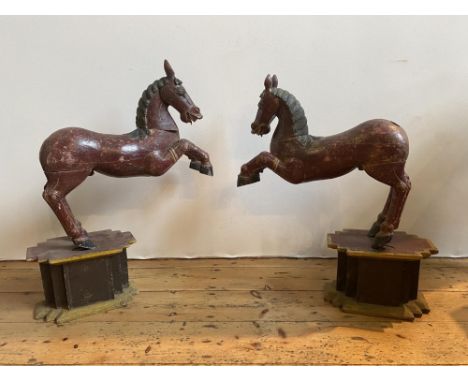 PAIR OF CARVED WOODEN HORSE FIGURES ON PLINTHS, 70cm high, 61 long 