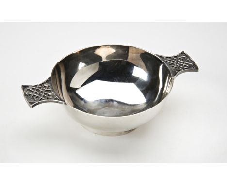 SILVER PORRINGEREDINBURGH 1978the two handles cast in relief with stylised Celtic knots14.5cm wide4.5 oz.143 grams