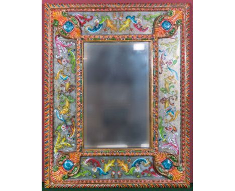 A mirror with decorative hand painted Mexican surround