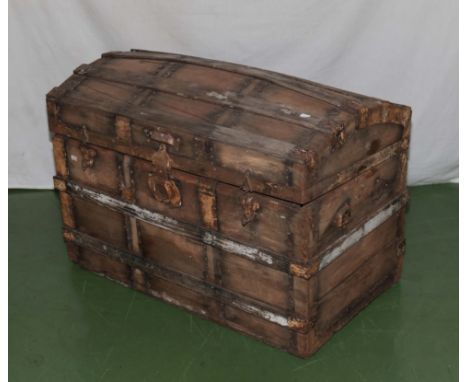 A domed top wooden trunk