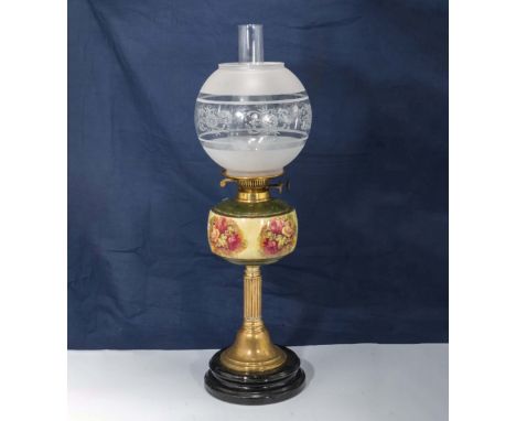 A brass and porcelain oil lamp