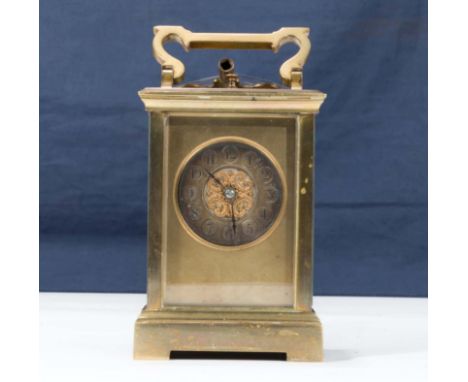 A small brass carriage clock