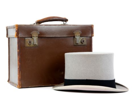 A Christies grey felt top hat, in original leather case 57.5cm.       Some light staining /wear marks to outer rim edge , 2 d