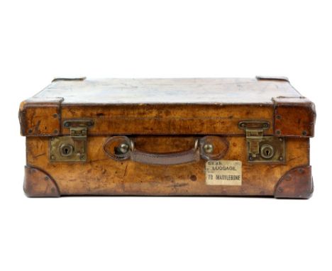 Vintage brown leather suit case with luggage labels.       61cmx 21cm depth x43cm high